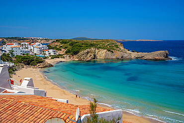 View of beach and rooftops in Arenal d'en Castell, Es Mercadal, Menorca, Balearic Islands, Spain, Mediterranean, Europe