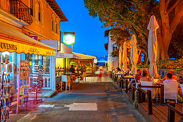 View of cafe and restaurant near the harbour at dusk, Lovran village, Lovran, Kvarner Bay, Eastern Istria, Croatia, Europe