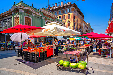 View of fruit and vegetable stall and exterior of ornate Central Market building, Rijeka, Croatia, Europe