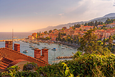 View of marina, rooftops and bay from elevated position in Volosko, Opatija, Kvarner Bay, Croatia, Europe