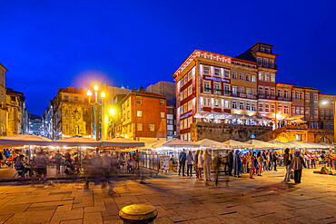 View of bars and restaurants at waterfront of Douro River at dusk, Porto, Norte, Portugal, Europe