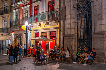 View of restaurant and buildings of the old town of Porto at dusk, Porto, Norte, Portugal, Europe