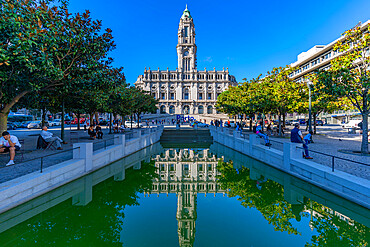 View of Porto Town Hall reflecting in Fonte dos Aliados in Praca do Municipio, Porto, Norte, Portugal, Europe