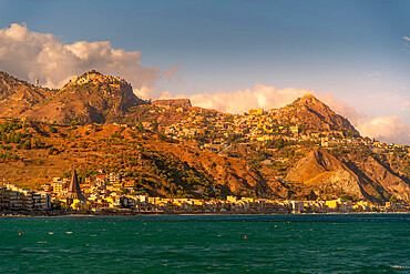 View of Castelmola, Taormina and Giardini Naxos viewed from Giardini Naxos beach, Sicily, Italy, Mediterranean, Europe