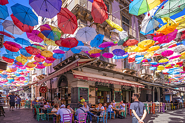 View of colourful umbrellas and restaurants on Via Gisira, Catania, Sicily, Italy, Mediterranean, Europe