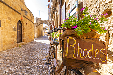 View of Rhodes sign in narrow cobbled street, Old Rhodes Town, UNESCO World Heritage Site, Rhodes, Dodecanese, Greek Islands, Greece, Europe