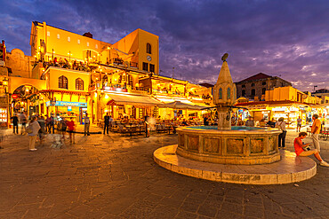 View of fountain in Hippocrates Square at dusk, Old Rhodes Town, UNESCO World Heritage Site, Rhodes, Dodecanese, Greek Islands, Greece, Europe