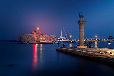 View of Saint Nicholas Fortress, Old Rhodes Town at dusk, UNESCO World Heritage Site, Rhodes, Dodecanese, Greek Islands, Greece, Europe