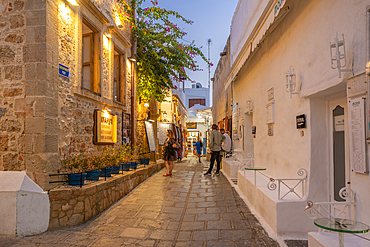 View of bar in Lindos street at dusk, Lindos, Rhodes, Dodecanese Island Group, Greek Islands, Greece, Europe