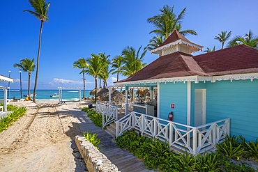 View of beach bar and palm trees on Bavaro Beach, Punta Cana, Dominican Republic, West Indies, Caribbean, Central America