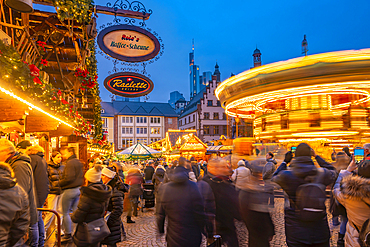 View of carousel and Christmas Market on Roemerberg Square at dusk, Frankfurt am Main, Hesse, Germany, Europe