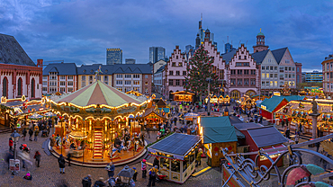 View of carousel and Christmas Market stalls at dusk, Roemerberg Square, Frankfurt am Main, Hesse, Germany, Europe