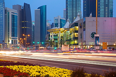 Contemporary architecture and traffic at dusk in the city centre, Doha, Qatar, Middle East