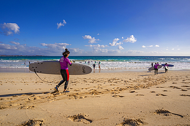 View of surfers on beach and the Atlantic Ocean, Corralejo Natural Park, Fuerteventura, Canary Islands, Spain, Atlantic, Europe