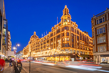 View of Harrods department store illuminated at dusk, Knightsbridge, London, England, United Kingdom, Europe