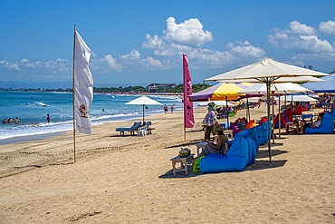 View of sunshades on sunny morning on Kuta Beach, Kuta, Bali, Indonesia, South East Asia, Asia