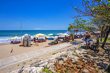 View of colourful sunshades on sunny morning on Kuta Beach, Kuta, Bali, Indonesia, South East Asia, Asia