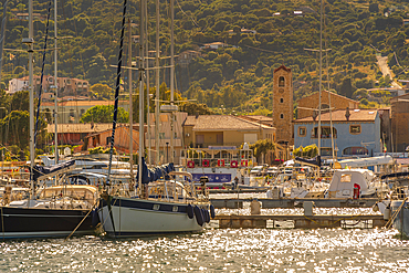 View of harbour and boats and church at Cannigione, Cannigione, Sardinia, Italy, Mediterranean, Europe