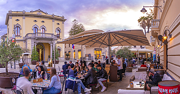 View of Information Centre and restaurant at dusk on Corso Umberto I in Olbia, Olbia, Sardinia, Italy, Mediterranean, Europe