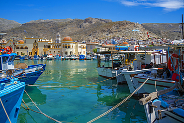 View of harbour boats in Kalimnos with hills in the background, Kalimnos, Dodecanese Islands, Greek Islands, Greece, Europe