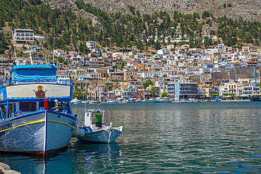 View of port and town of Kalimnos with hills in the background, Kalimnos, Dodecanese Islands, Greek Islands, Greece, Europe