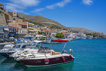 View of harbour boats in Kalimnos with hills in the background, Kalimnos, Dodecanese Islands, Greek Islands, Greece, Europe