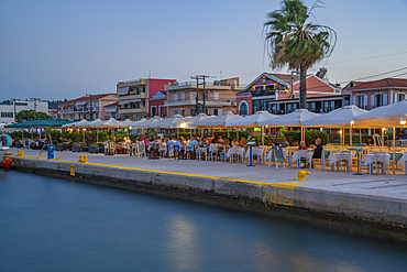 View of cafe and restaurant at the harbour at dusk, Lixouri, Kefalonia, Ionian Islands, Greek Islands, Greece, Europe