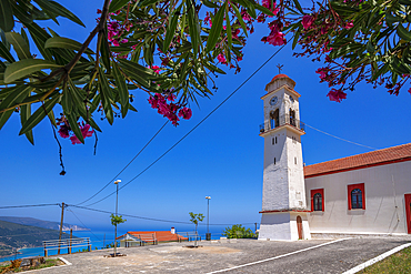 View of church overlooking coastline, sea and hills near Agkonas, Kefalonia, Ionian Islands, Greek Islands, Greece, Europe