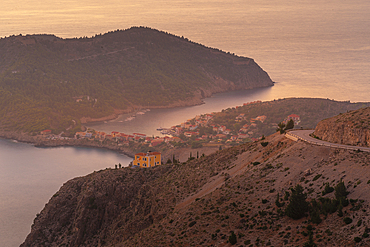 View of Assos, coastline, sea and hills at sunset, Assos, Kefalonia, Ionian Islands, Greek Islands, Greece, Europe