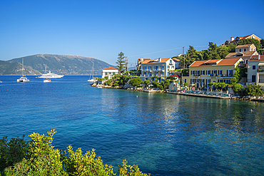 View of hotels overlooking Fiscardo harbour, Fiscardo, Kefalonia, Ionian Islands, Greek Islands, Greece, Europe