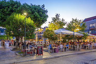 View of restaurant in Vallianou Square at dusk, capital of Cephalonia, Argostolion, Kefalonia, Ionian Islands, Greek Islands, Greece, Europe