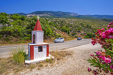 View of mini church (shrine) and road near Lourdata, Kefalonia, Ionian Islands, Greek Islands, Greece, Europe