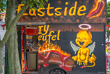 View of colourful fast food outlet near Eastside section of the former Berlin Wall along the Spree River, Berlin, Germany, Europe