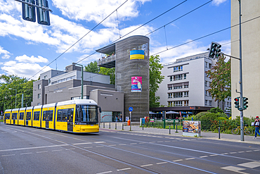 View of yellow city tram at the Berlin Wall Memorial, Memorial Park, Bernauer Strasse, Berlin, Germany, Europe