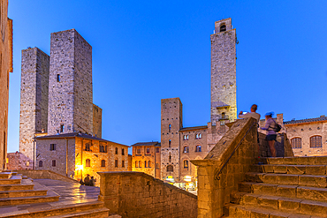 View of towers in Piazza del Duomo at dusk, San Gimignano, UNESCO World Heritage Site, Province of Siena, Tuscany, Italy, Europe