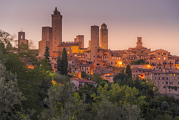 View of San Gimignano skyline at dusk, San Gimignano, UNESCO World Heritage Site, Province of Siena, Tuscany, Italy, Europe