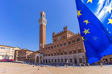 View of EU flags and Palazzo Pubblico in Piazza del Campo, UNESCO World Heritage Site, Siena, Tuscany, Italy, Europe