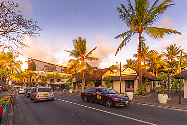 View of palm trees and boutique shops in Grand Bay at sunset, Mauritius, Indian Ocean, Africa