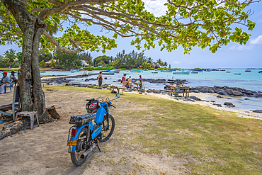 View of beach and traders on sunny day in Cap Malheureux, Mauritius, Indian Ocean, Africa