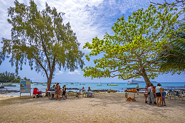 View of beach and traders on sunny day in Cap Malheureux, Mauritius, Indian Ocean, Africa