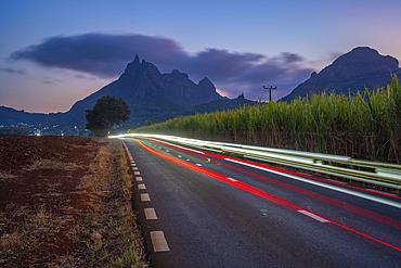 View of trail lights and Long Mountains at dusk near Beau Bois, Mauritius, Indian Ocean, Africa