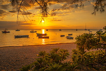 View of boats at Mon Choisy Public Beach at sunset, Mauritius, Indian Ocean, Africa