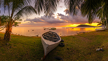 View of Le Morne through palm trees at Le Morne Brabant at sunset, Savanne District, Mauritius, Indian Ocean, Africa