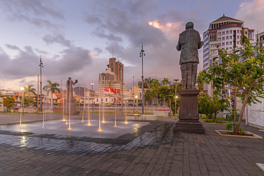 View of statue in Caudan Waterfront in Port Louis at dusk, Port Louis, Mauritius, Indian Ocean, Africa