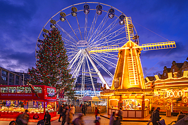 View of ferris wheel and Christmas Market on Old Market Square at dusk, Nottingham, Nottinghamshire, England, United Kingdom, Europe