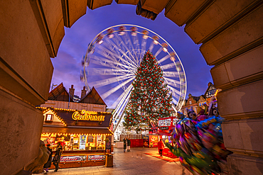 View of ferris wheel and Christmas Market on Old Market Square at dusk, Nottingham, Nottinghamshire, England, United Kingdom, Europe