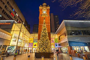 View of Victoria Station Clock Tower and Christmas tree at dusk, Nottingham, Nottinghamshire, England, United Kingdom, Europe