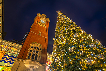 View of Victoria Station Clock Tower and Christmas tree at dusk, Nottingham, Nottinghamshire, England, United Kingdom, Europe