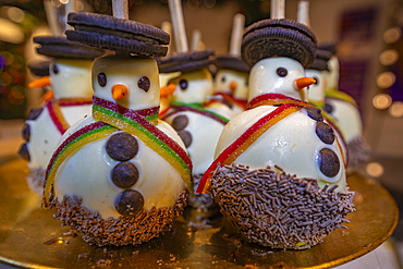 Snowmen on Christmas Market stall in Old Market Square at dusk, Nottingham, Nottinghamshire, England, United Kingdom, Europe