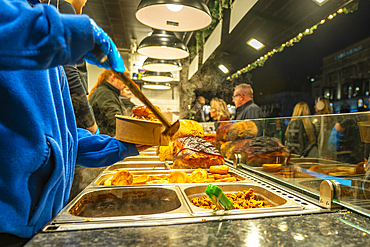 View of food stall on Christmas Market at St. Georges Hall, Liverpool City Centre, Liverpool, Merseyside, England, United Kingdom, Europe